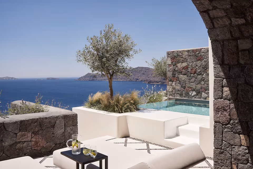 Private infinity pool suite at Canaves Oia Suites overlooking the Santorini caldera at sunset
